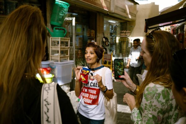 Food tour guide explaining Chips Oman - Old Dubai Quickie Snacking Tour - Frying Pan Adventures - Dubai food tour