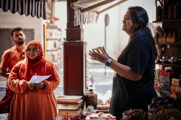Guide explaining spices in the Spice Souk - Dubai Souks and Creekside Food Walk (1)